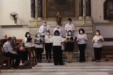 Group of people singing hymns in church