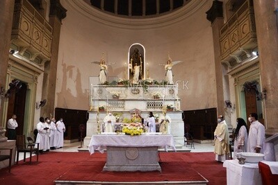 Group of priests praying in the church to celebrate Easter