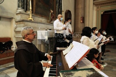 Pianist plays with the choir inside the church