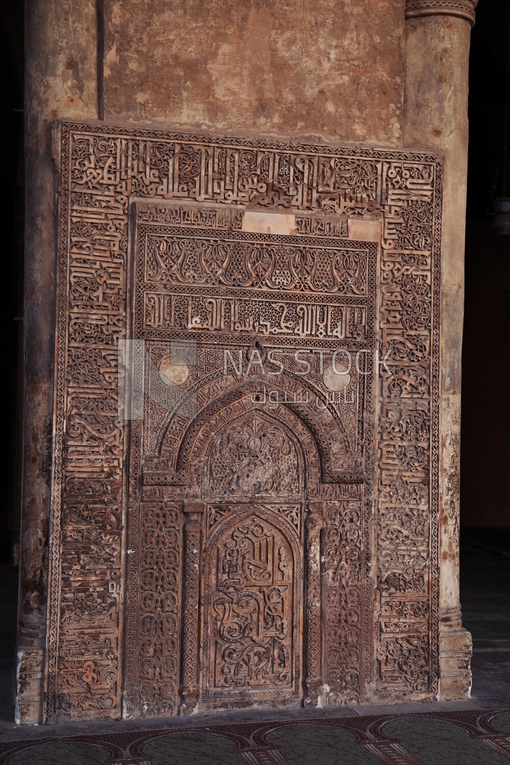 Islamic decorative inscriptions on one of the columns of the Ibn Tulun Mosque, Cairo, Egypt.