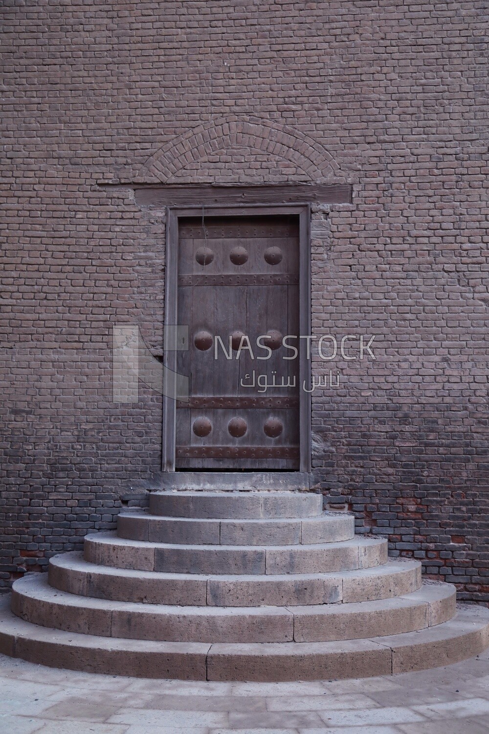 One of the 19 entrance doors to the Ibn Tulun Mosque in Cairo , egypt