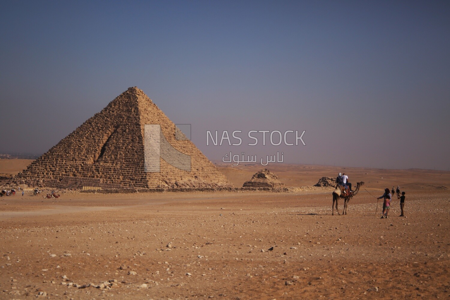 Egyptian desert landscape with pyramid