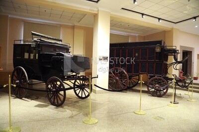 Two different-style cars from ancient times on display at the Royal Vehicles Museum, Cairo, Egypt.