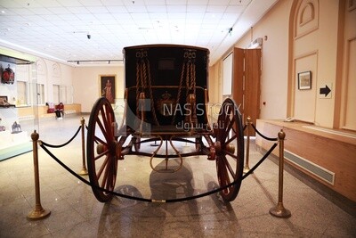 Picture of a royal chariot from the back on display in the Royal Chariot Museum, Cairo, Egypt.