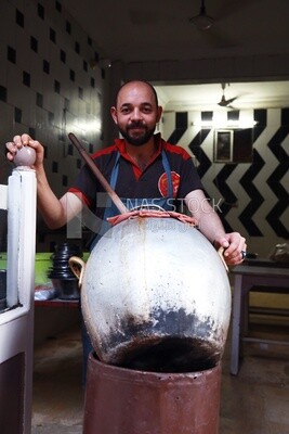Seller in an Egyptian traditional food store