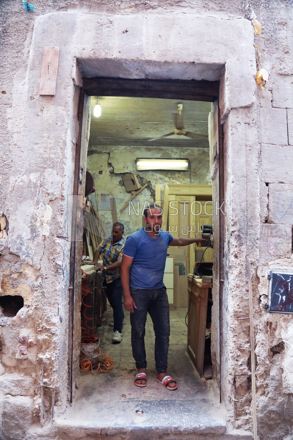 Craftsman standing in a furniture workshop