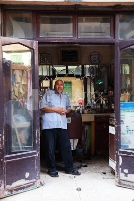 Man in an old barber shop