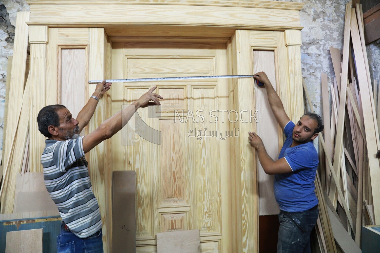 Craftsmen working in a furniture manufacturing workshop