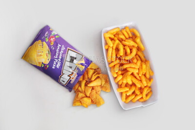 Crunchy corn snacks on a white