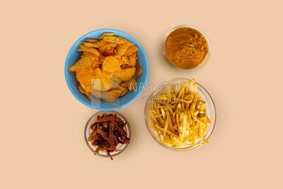 Crispy corn snacks and potato chips