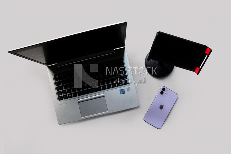 laptop, phone holder, smartphone . top view