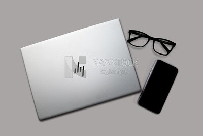 Top view laptop with smartphone
