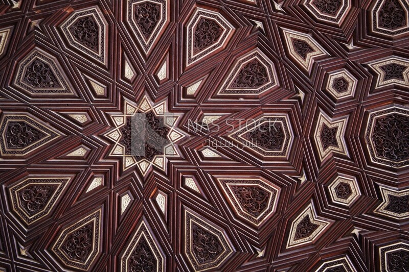 Close-up of the intricately carved inlaid wood wall, History, Tourism in Egypt