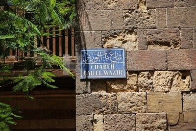 Hanging street name signs on the wall