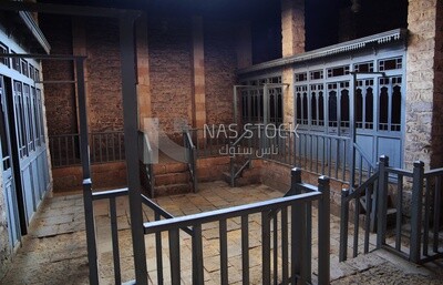 Changing rooms with blue wooden door shutters and wooden balustrades in The Sultan Inal Bath, a public bath built by Sultan Al-Ashraf Inal, El-Moez Street, Cairo, Egypt