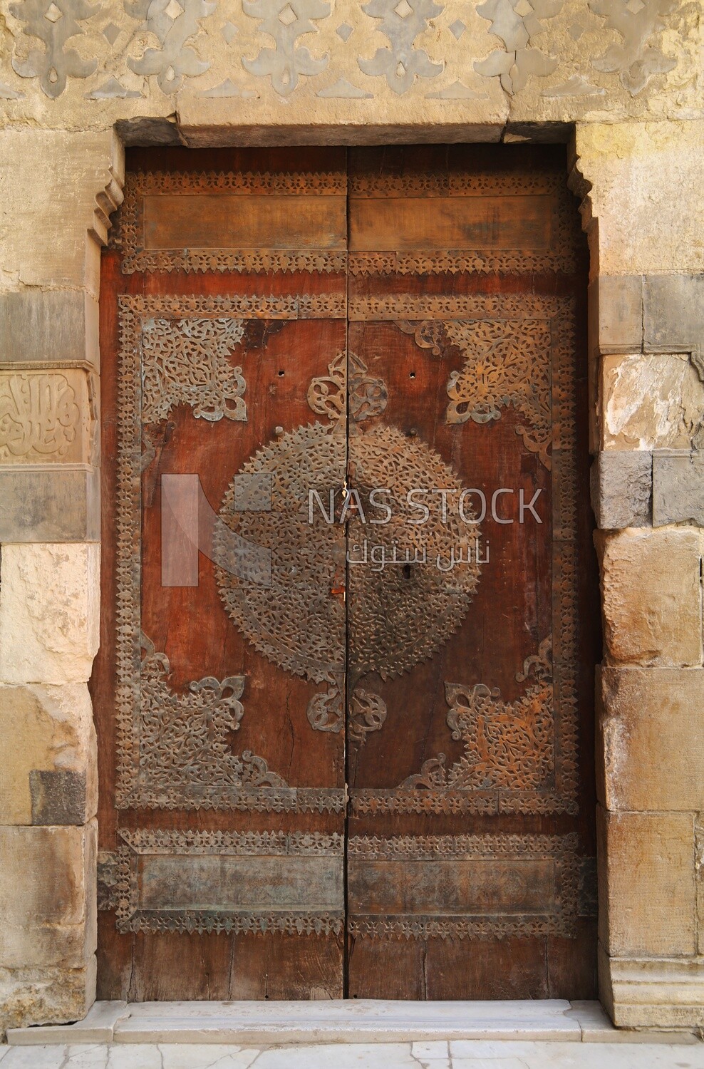 Wooden decorated door at Sultan Barquq mosque, tourism in Egypt,  El-Moez Street, Cairo, Egypt