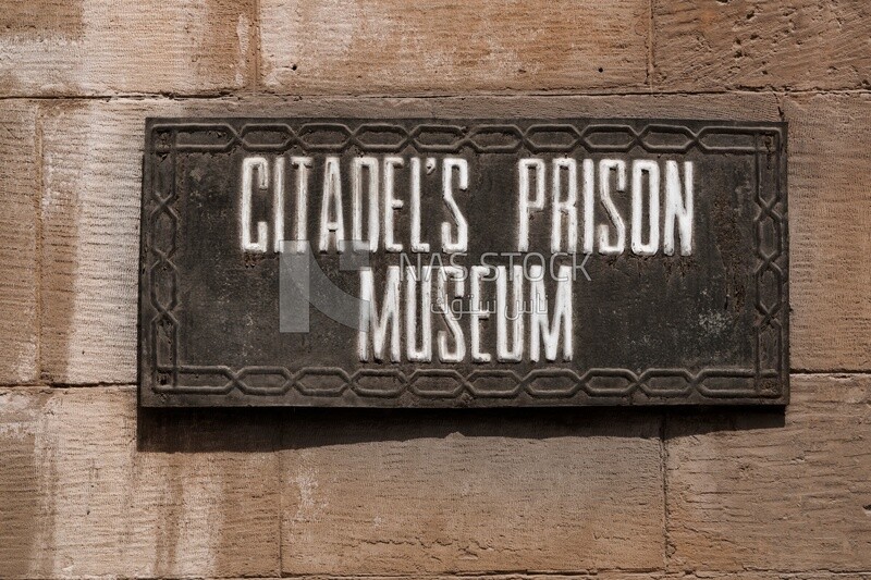 Citadel Sign Hanging sign with the name of the citadel's prison museum on the wall