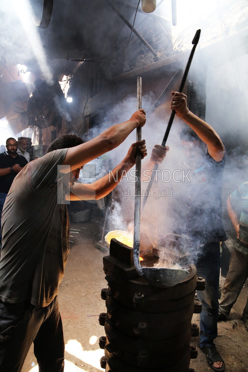 Two men working in the casting foundries
