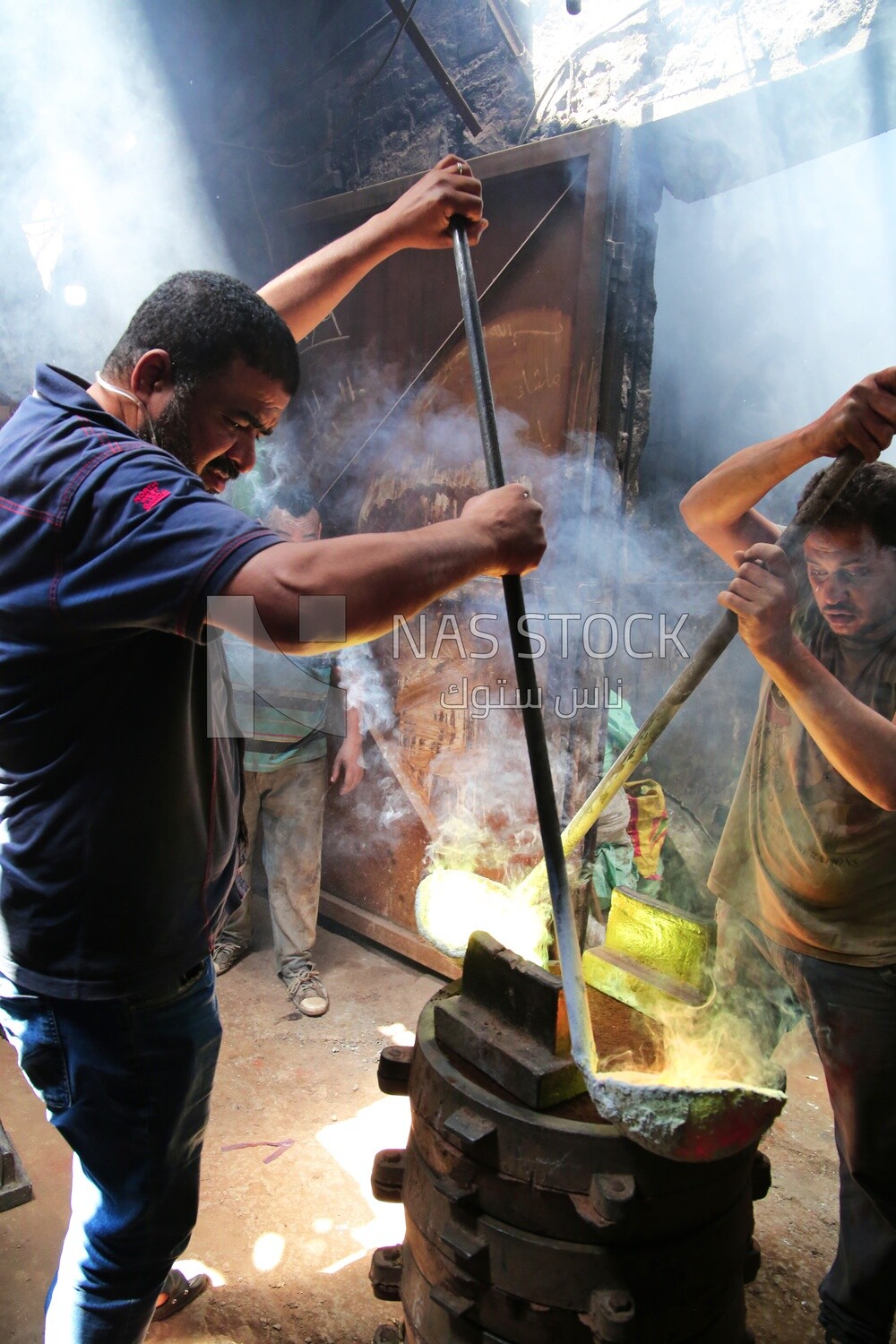 Two men working in the casting foundries