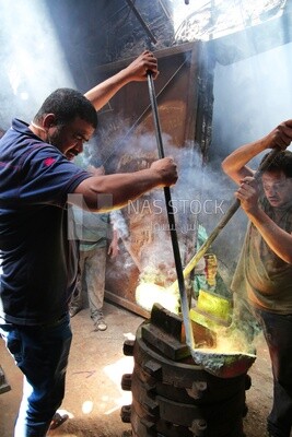 Two men working in the casting foundries