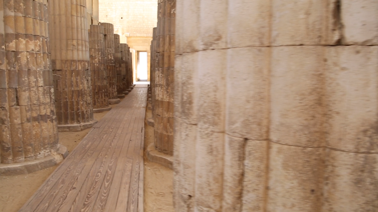 Roofed colonnade corridor leading into the Djoser&#39;s step pyramid in Saqqara Archeology site