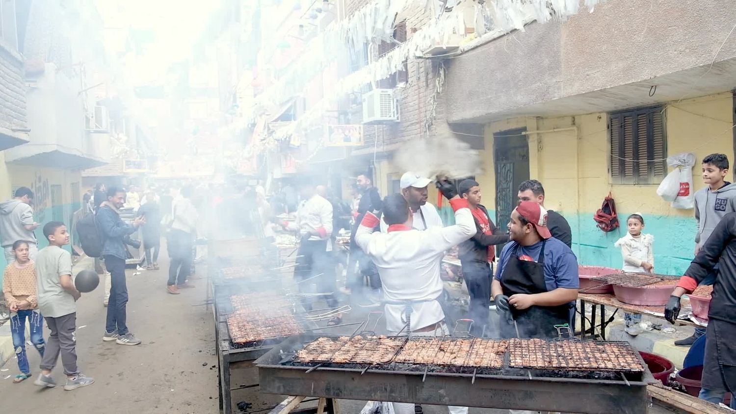 men standing in front of the grill cooking, Ramadan Kareem, preparing their iftar
