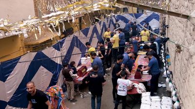 View of people in Matareya sharing their iftar together in the street, Ramadan Kareem, preparing their iftar