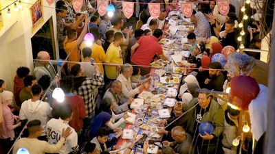 View of people in Matareya sharing their iftar together in the street, Ramadan Kareem, preparing their iftar