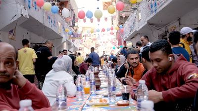 View of people in Matareya sharing their iftar together in the street, Ramadan Kareem, preparing their iftar