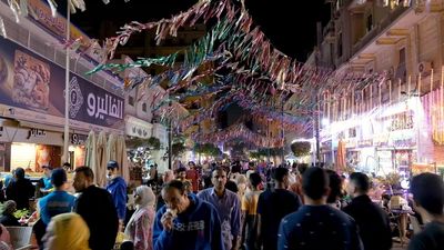 People walking in the street, Ramadan Kareem