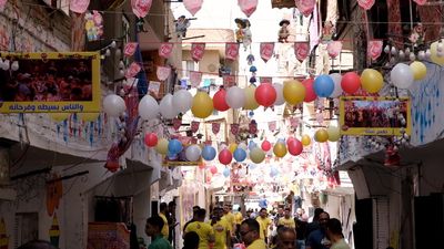 View of people in Matareya sharing their iftar together in the street, Ramadan Kareem, preparing their iftar