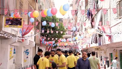 Photo of men organizing the event of iftar Matareya, Ramadan Kareem, preparing their iftar