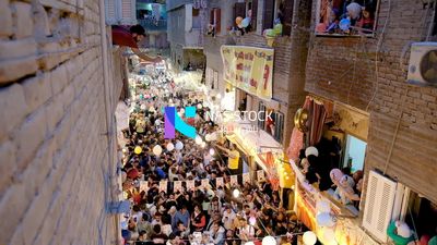 View of people in Matareya sharing their iftar together in the street, Ramadan Kareem, preparing their iftar