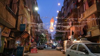 Hanging Ramadan lanterns in the street, decoration lights