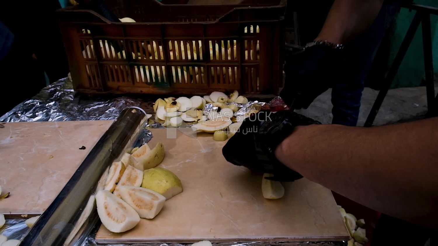 Video of a man cutting Guava into slices, Ramadan Kareem, preparing their iftar