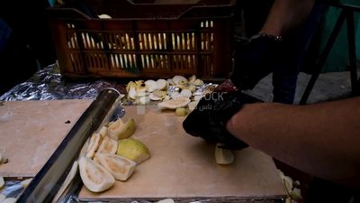 Video of a man cutting Guava into slices, Ramadan Kareem, preparing their iftar