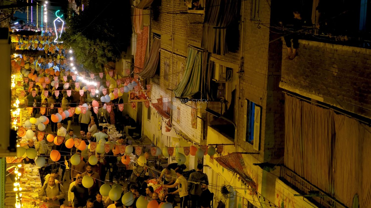 View of people in Matareya sharing their iftar together in the street, Ramadan Kareem, preparing their iftar