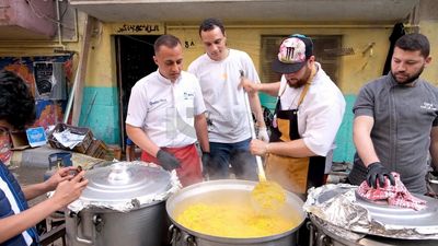 Men standing and cooking, Ramadan Kareem, preparing their iftar