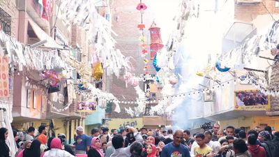 View of people in Matareya sharing their iftar together in the street, Ramadan Kareem, preparing their iftar