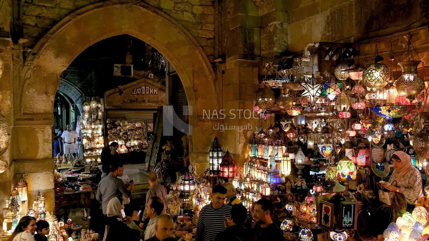 People on Al Moez Street at night, decoration lights