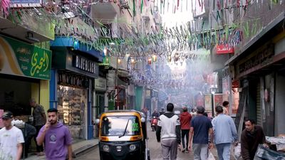 people walking in the street, Ramadan Kareem