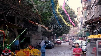 People walking in the street, Ramadan Kareem