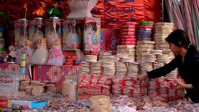 Girl standing and organizing the candies of Prophet Muhammad&#39;s Birth