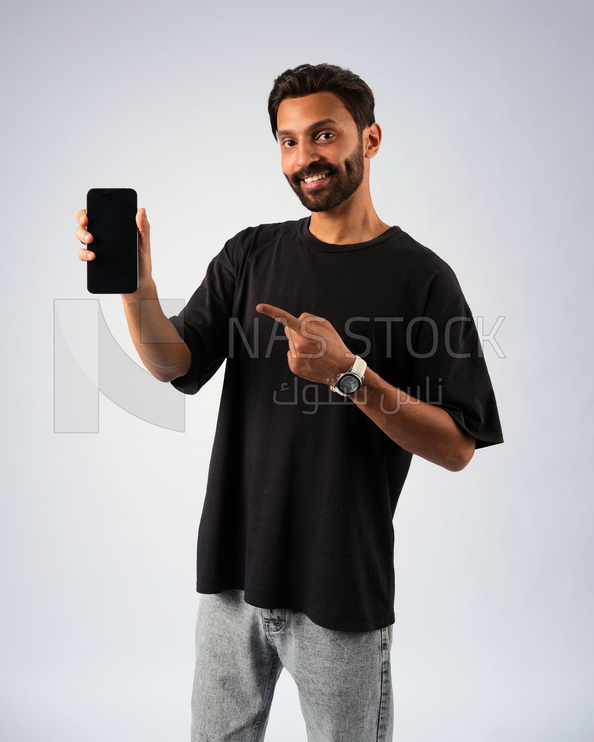 Guy in youth clothes and holding a mobile