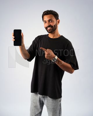 Guy in youth clothes and holding a mobile