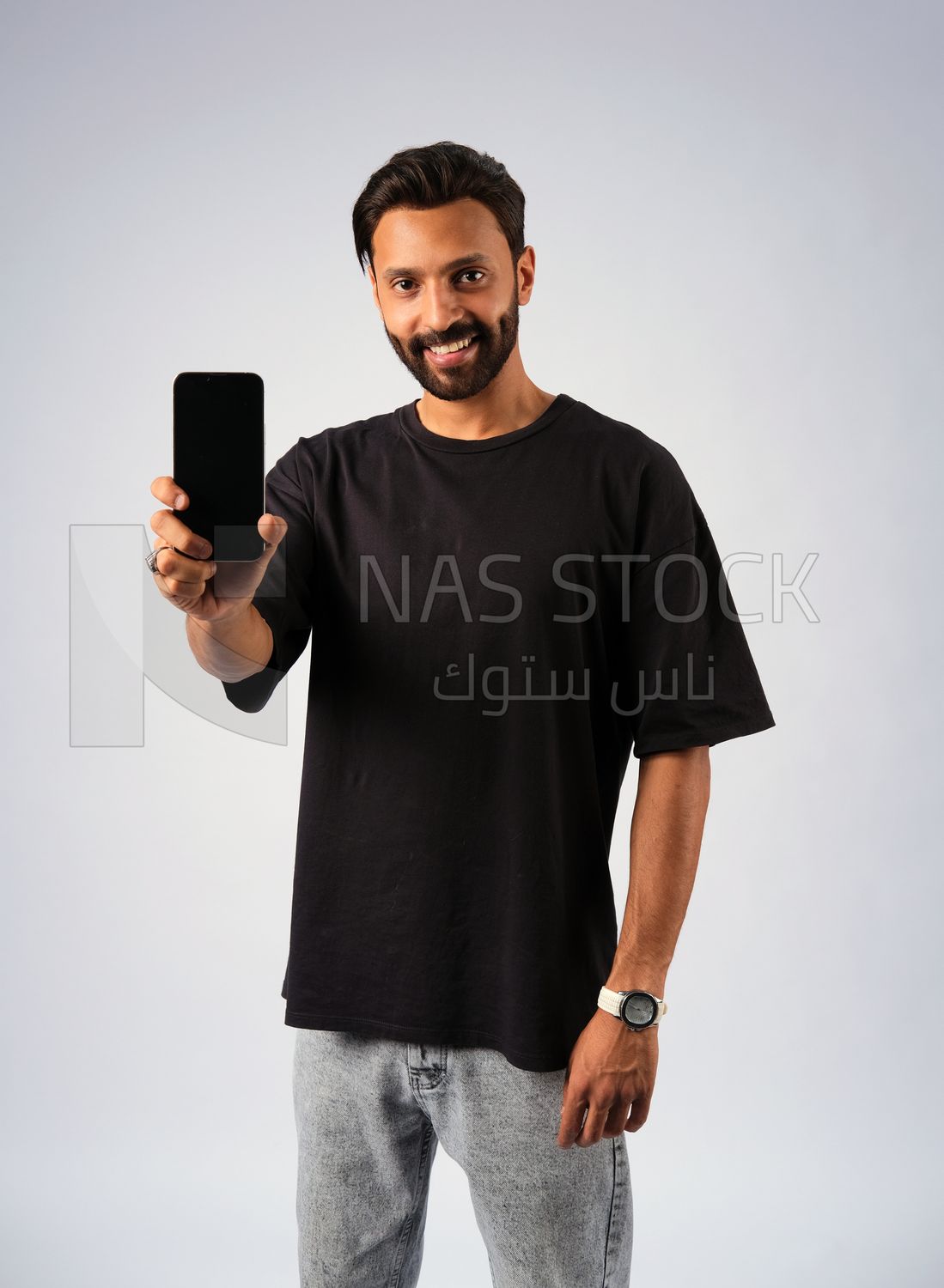 Guy in youth clothes and holding a mobile
