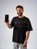 Guy in youth clothes and holding a mobile