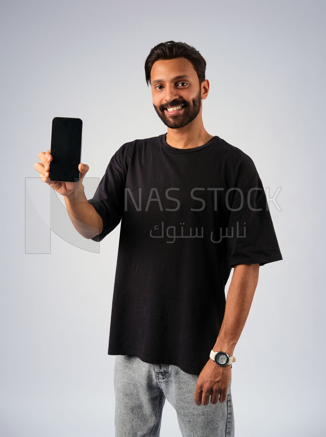 Guy in youth clothes and holding a mobile