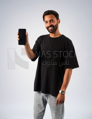 Guy in youth clothes and holding a mobile