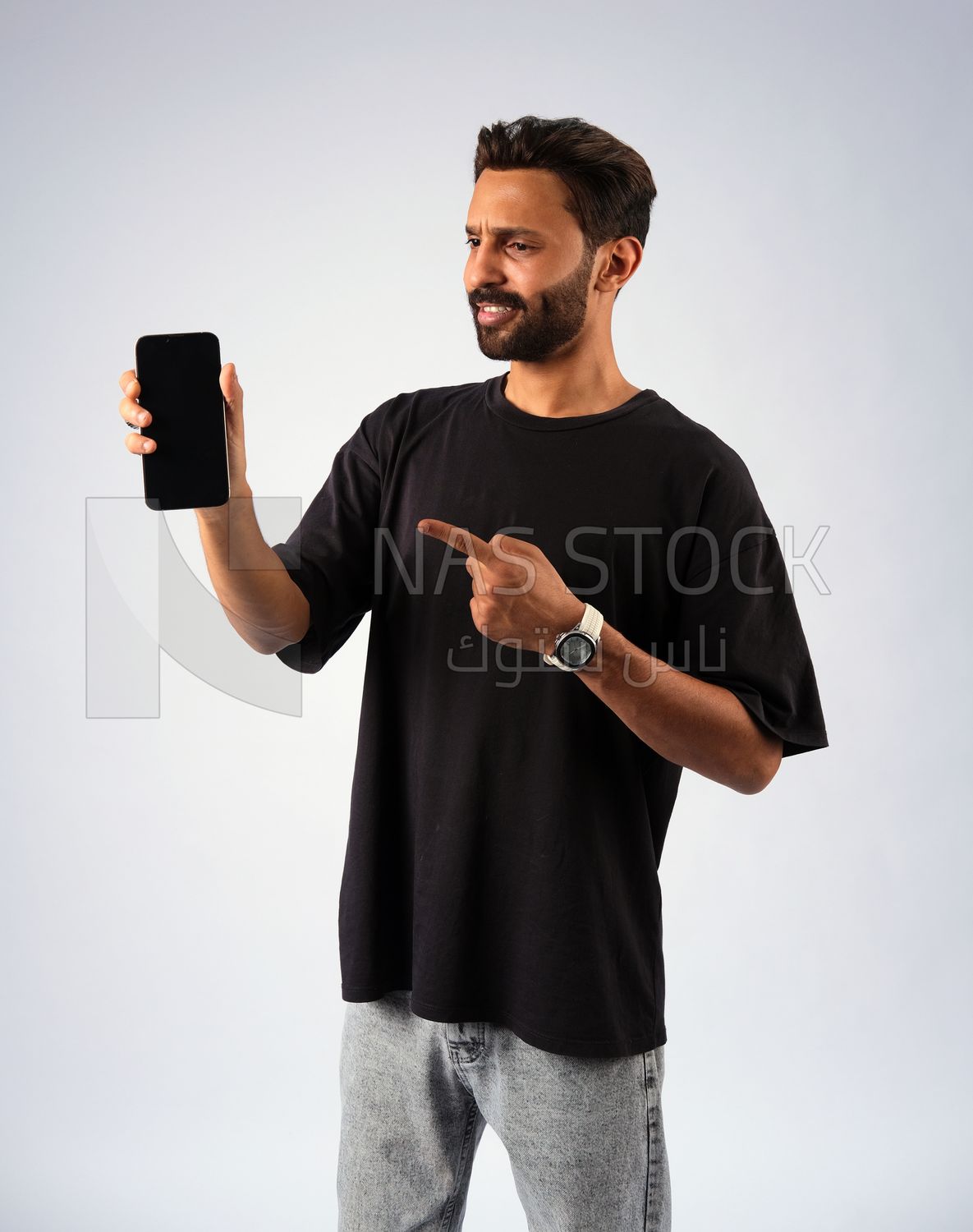 Guy in youth clothes and holding a mobile